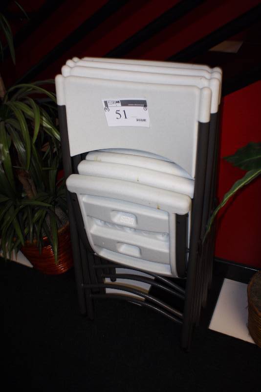 lot 51 image: Lot of (4) Plastic Folding Chairs wWhite Seats & Black Frames.