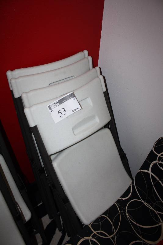 lot 53 image: Lot of (4) Plastic Folding Chairs wWhite Seats & Black Frames.