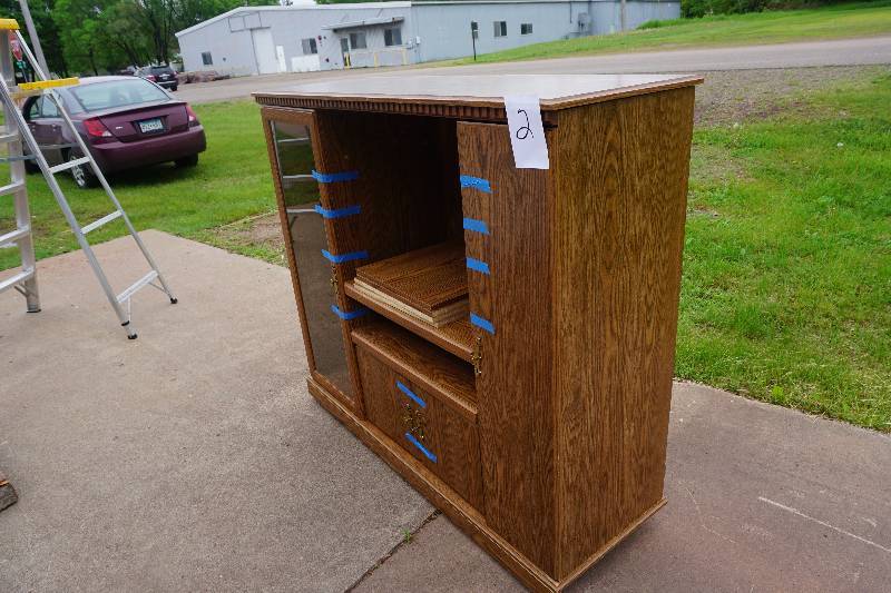 lot 2 image: Wheeled Wood Entertainment Center