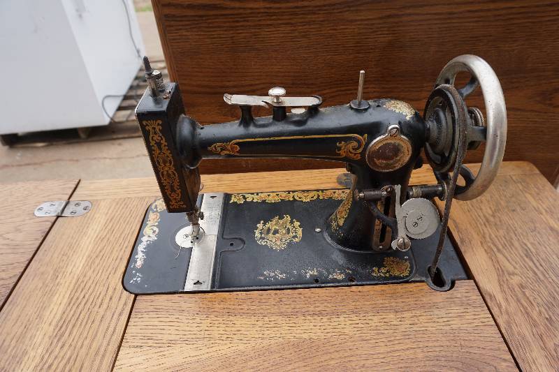 lot 8 image: Antique Treadle Sewing Machine With Metal Framed Wood Stand