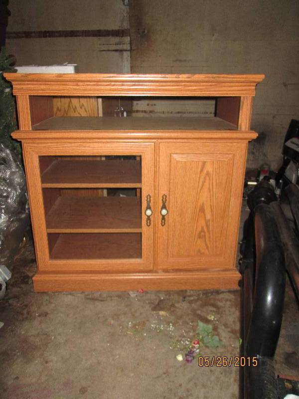 lot 2 image: Solid wood entertainment center wit...