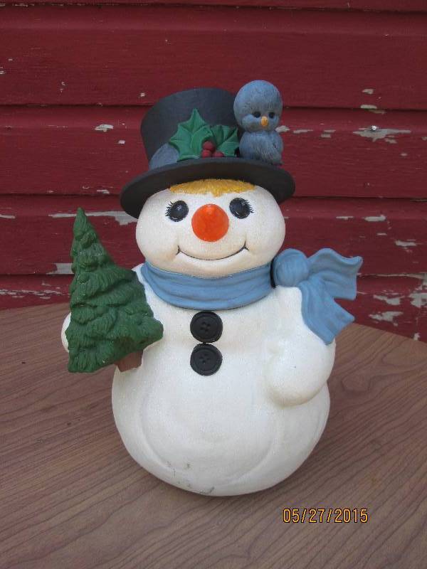 lot 42 image: A sweet porcelain snowman all dress...