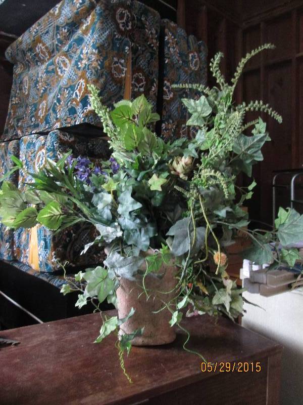 lot 80 image: Large floral arrangement in a stone...