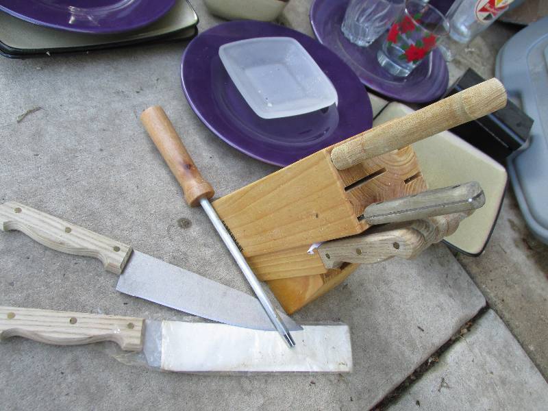 Dishes and a Faberware knife set in...
