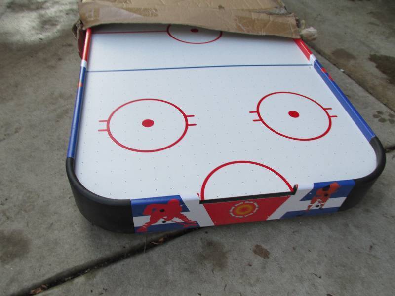 Brand new air hockey game, legs are...