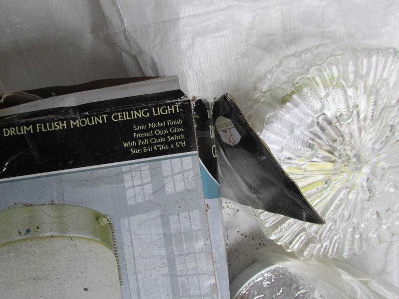 3 light fixtures, one has no globe...