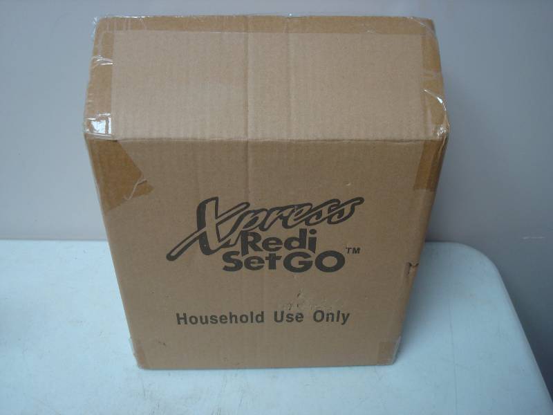 lot 107 image: New In The Box, Xpress Redi Set Go, Cooker