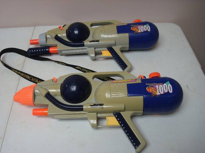 lot 145 image: Pair of Super Soakers, Broke For Parts, Sold As Is