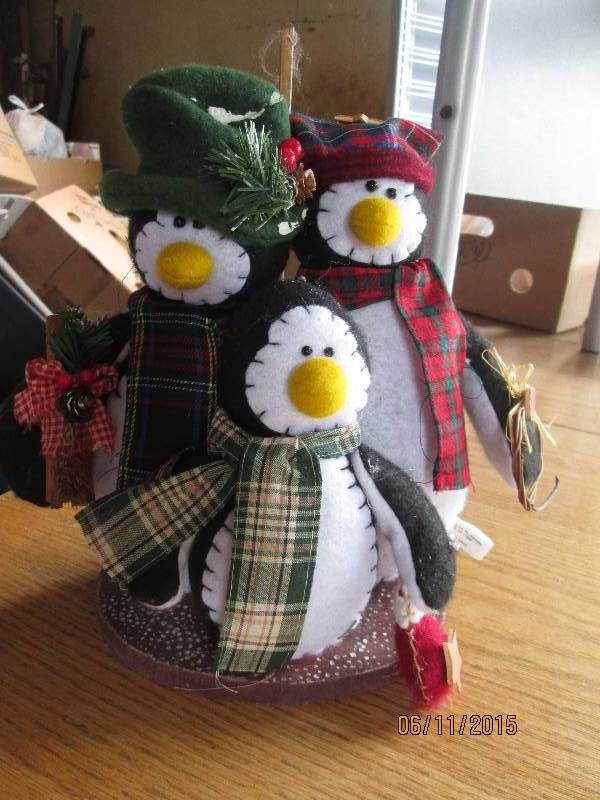 Cute penguin family dressed up for ...