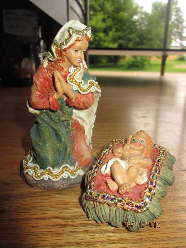 Mother Mary and child in manger fig...