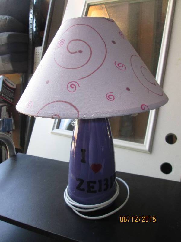 Small purple lamp with shade. ...
