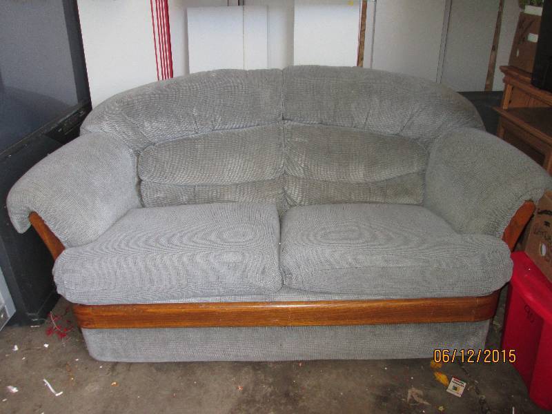 BlueGray loveseat with wood accent...