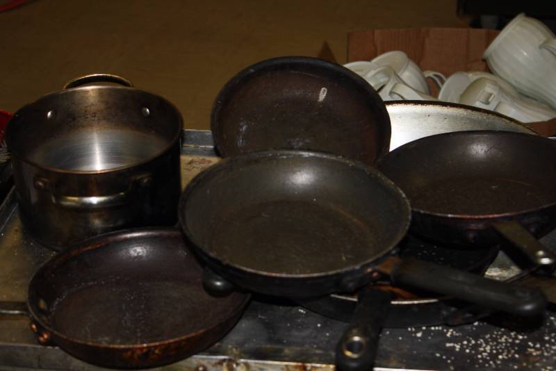lot 22 image: Lot of (7) Including Metal Pot Metal Commercial Frying Pans Miscellaneous Sizes.