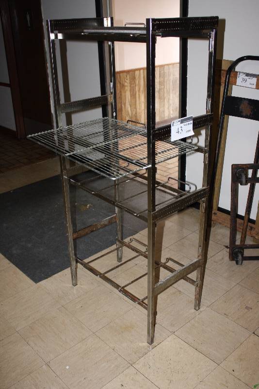 lot 43 image: Metal Shelving Unit wGrate Shelves 16 x 28 x 62 Includes Metal Baking Rack.
