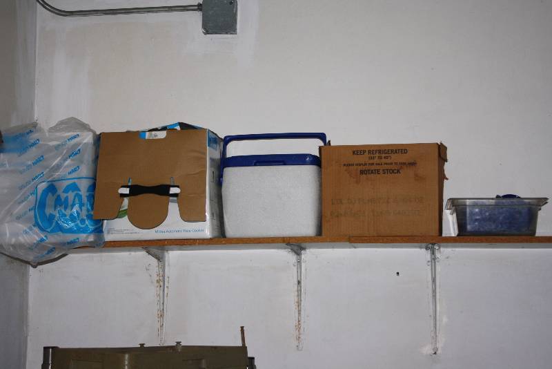 lot 61 image: Shelf Lot Including Plastic Bins Sanitizer Rag Tub And More.