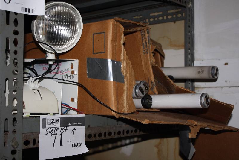 lot 71 image: Shelf Lot Including Fluorescent Light Bulb Tubes Exterior Light wHousing & Cords And More.