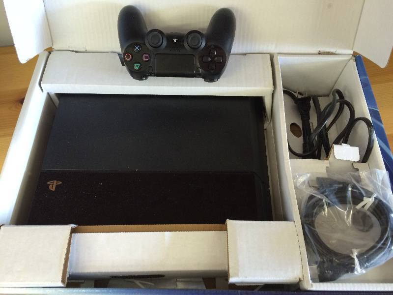lot 97 image: Ps4 console with cords and controller  retail $399