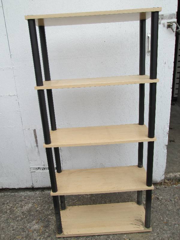 Shelf with wood tone shelves, and p...