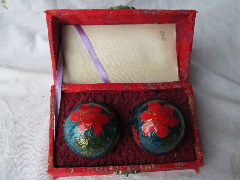 Pair of musical Oriental balls, cas...