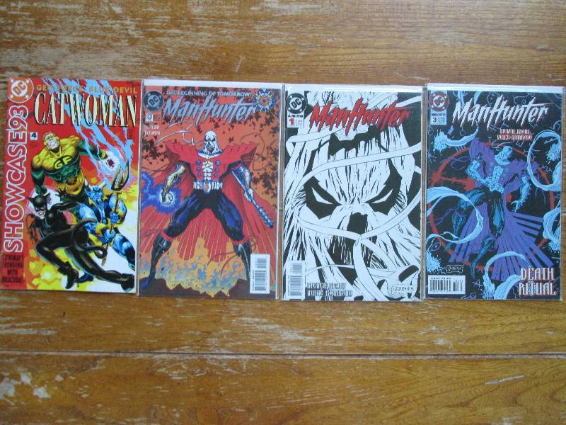 lot of 4 comic books- man hunter, a...