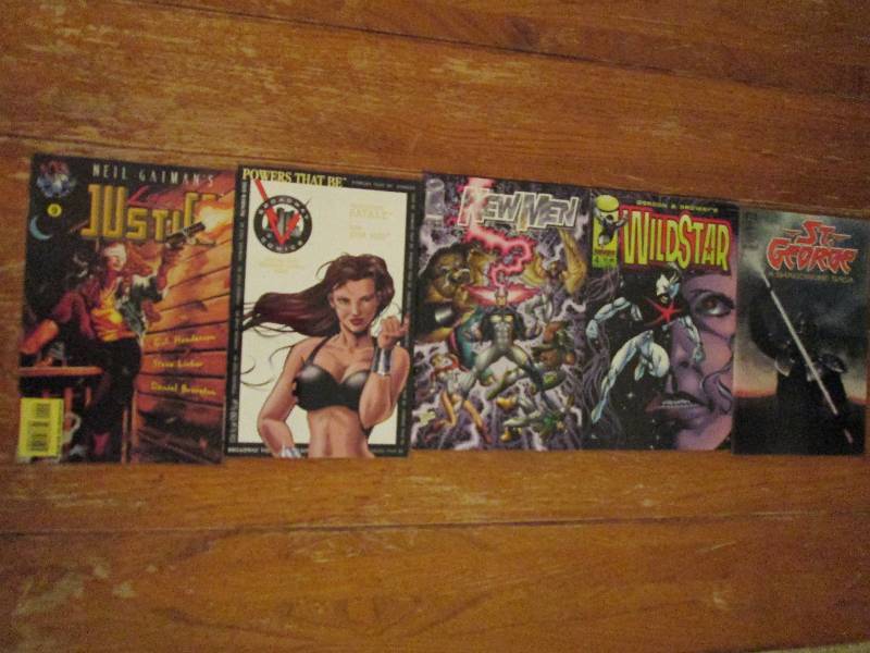 lot of 5 comic books- new men, wild...