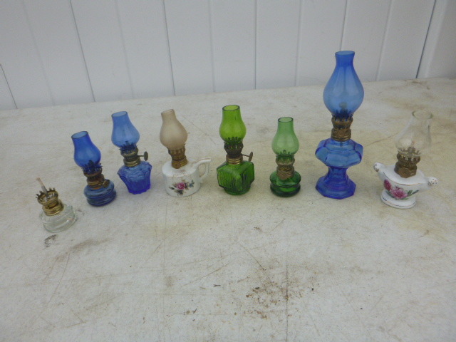 lot 70 image: 8 Small Oil Lamps