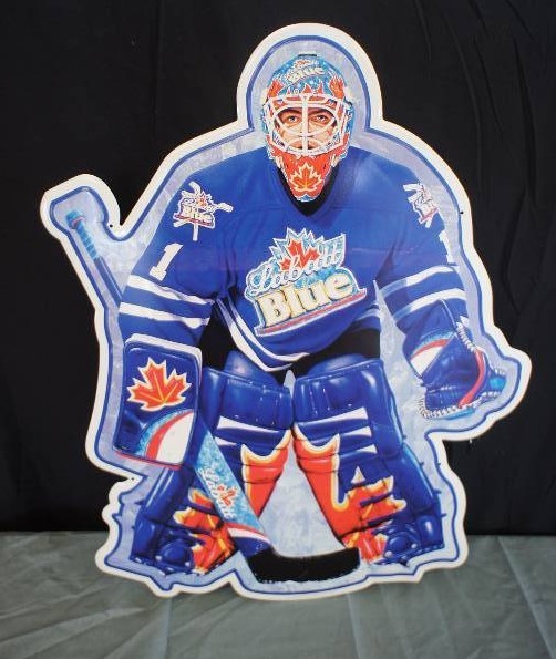 lot 58 image: Labatt Blue Maple Leaf Goalie Embossed Tin Sign