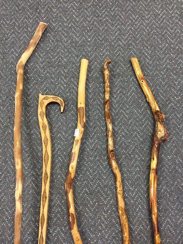 lot 11 image: One Hand Carved Cane & 4 Diamond Willow Walking Sticks