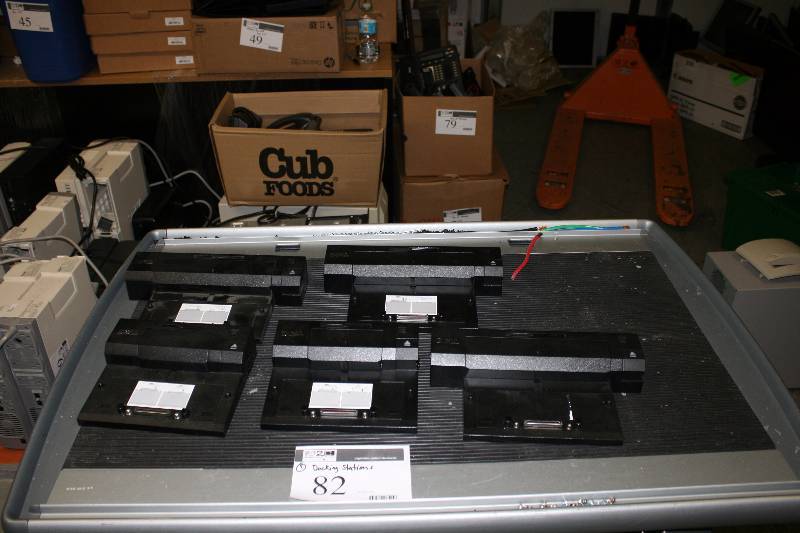 lot 82 image: Lot of (5)  Laptop Port ReplicatorsDocking Stations Including Dell E Port Plus Port Replicator 08RNJ7Dell K09A CN-0HJVX1 E-Port Plus DockingDock Station Port And More.