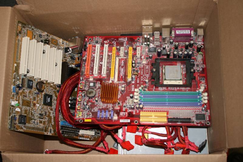 lot 87 image: Box Lot of Miscellaneous Computer Hardware & Electronics Including Cords Vortec Fan And More.