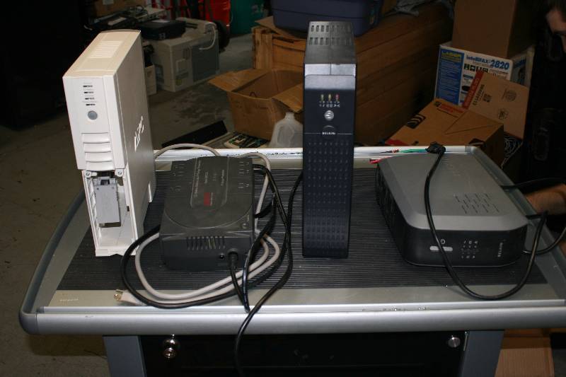 lot 56 image: Lot of (4) Battery Back-Ups Belkin & APC 3 of 4 Powered On.