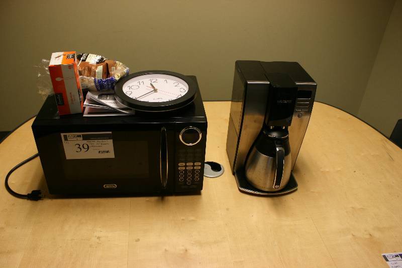 lot 39 image: Lot of (3) Including Mr. Coffee Coffeemaker Clock, 10 Diameter Sunbeam Microwave, 19 x 15 x 11.