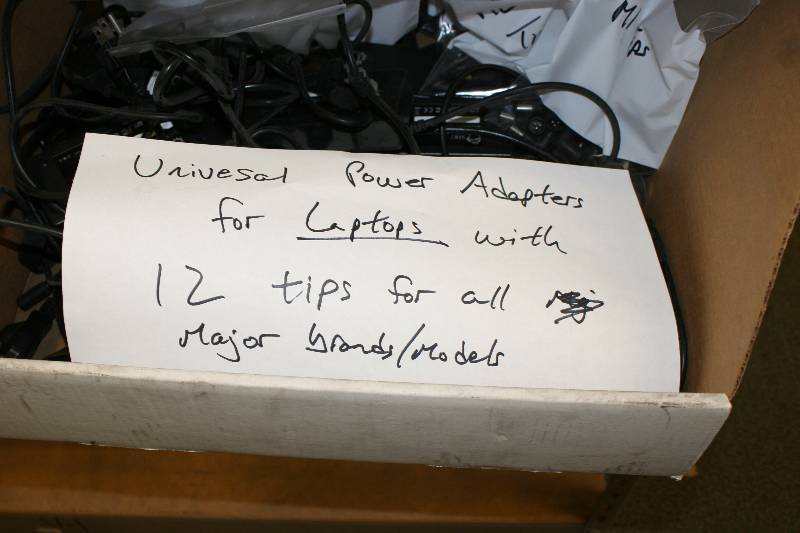 lot 128 image: Shelf Lot Including Universal Power Adapters For Laptops w12 Tips For All Major BrandsModels And More.