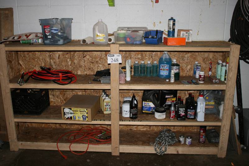 lot 248 image: Contents of Shelving Units Including Propane Tank Cleaning Materials Jumper Cables And More Does Not Include Shelves.