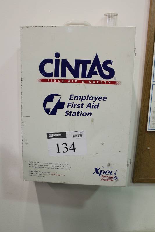 lot 134 image: Cintas Emergency Medical Supply Wall Cabinet wCintas Brand Supplies Including General Pain Relievers, Antibacterial Creams And More.
