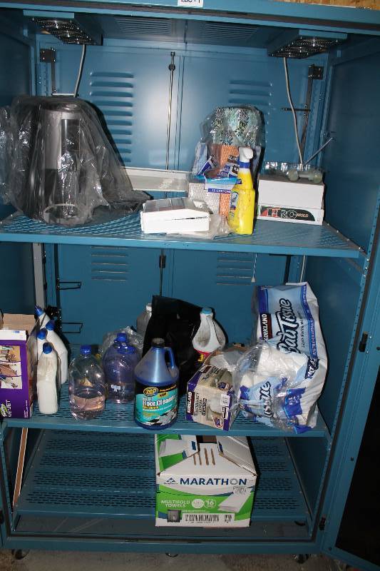 lot 140 image: Contents Of Metal Cabinet Does Not Included Cabinet Including Flavia Coffee Maker Cleaning Supplies Hand Soap And More.