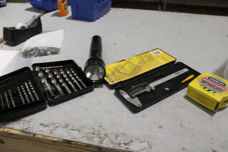 lot 144 image: Tool Lot Including Drill Bit Set Flash Light Measuring Tape And More.