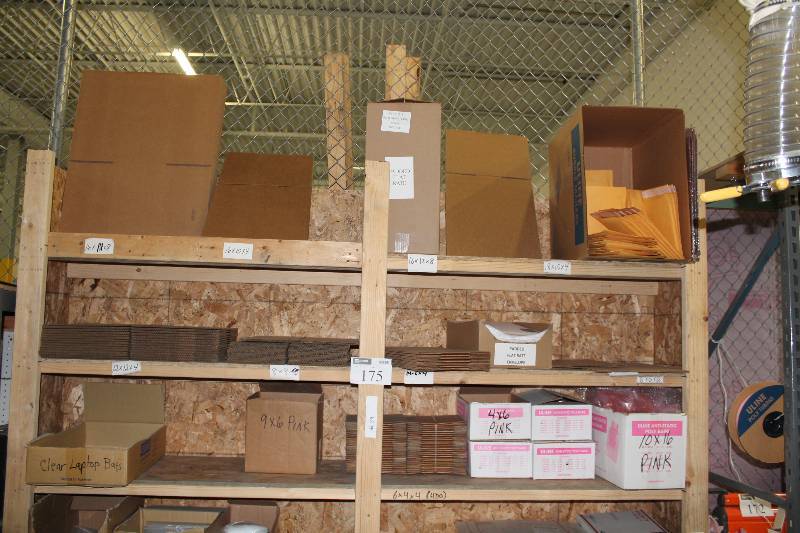 lot 175 image: Top 3 Shelves Lot Including U-Line Anti Static Poly Bags Cardboard Boxes, 12 x 12 x 14, 8 x 8 x 8 And More.
