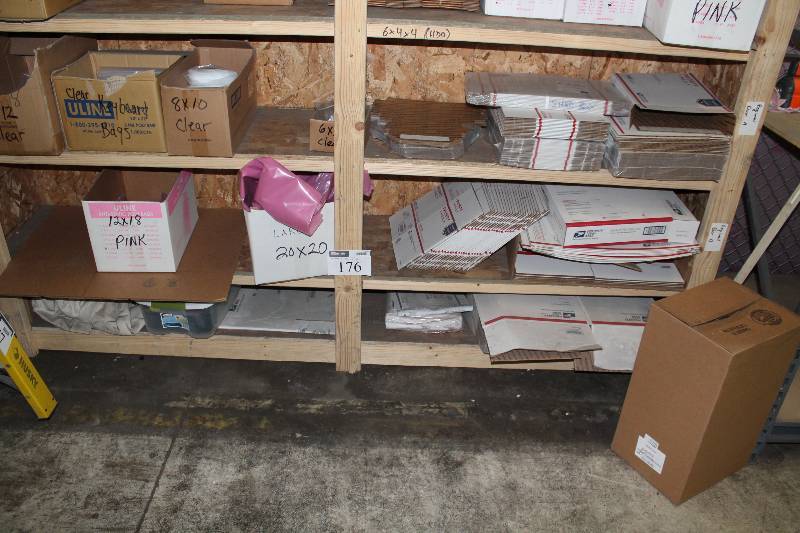 lot 176 image: Bottom 3 Shelves Lot Including Priority Mail Boxes U-Line Clear Poly Bags, 9x 12, 8 x 10 And More.