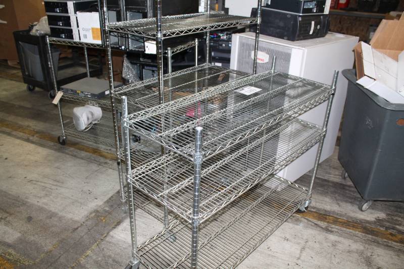 lot 180 image: Lot of (4) Metal Grate Shelving Units wWheels Shelves (13) 18x x 36 x 57.5 18 x 47.5 x 41 (3) Contents Not Included.