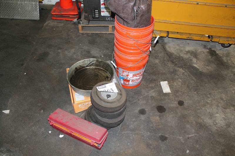 lot 263 image: Floor Lot Including Tires 5 Gal. Buckets Plastic Containers And More.