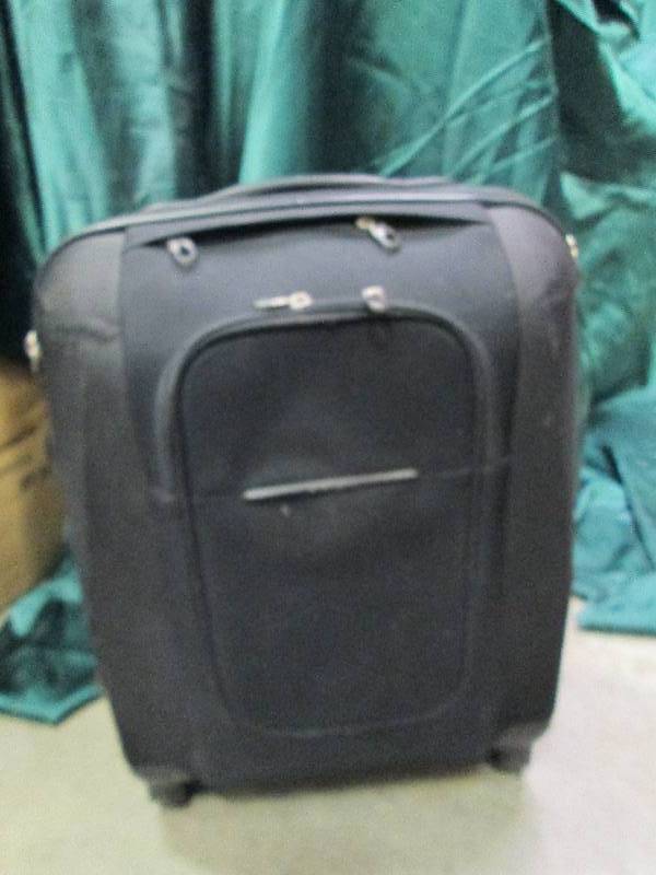 lot 10 image: Black small suitcase on wheels very...