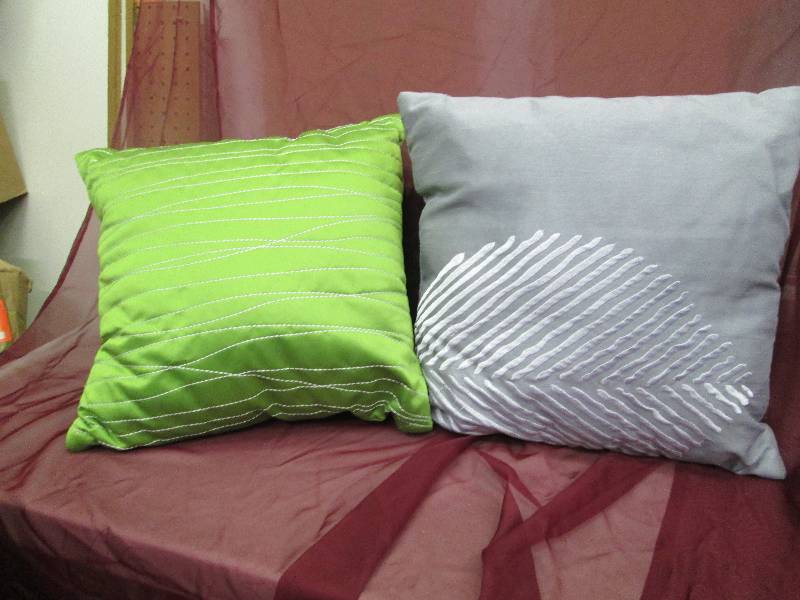 lot 77 image: Qty 2 pillows one green and one gra...