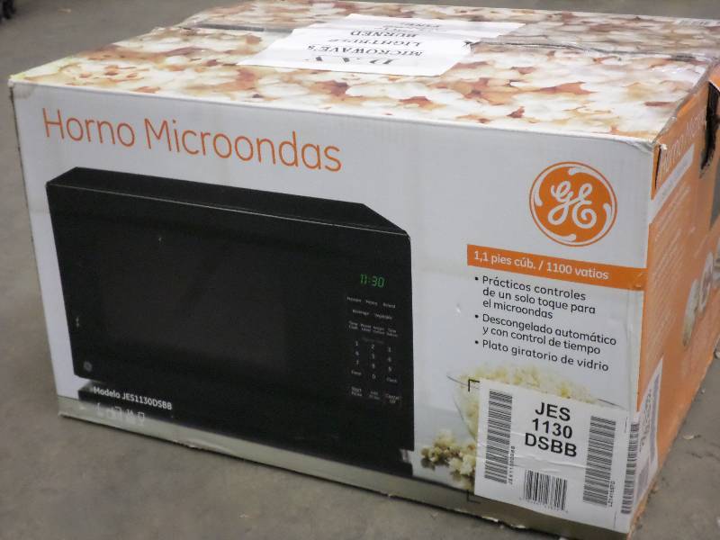 lot 47 image: GE Microwave, Works But The Light B...