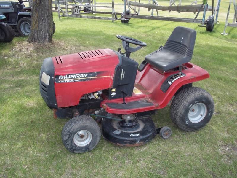 lot 58 image: Murry riding mower 16 HP Twin  motor, 42 deck, 5 forward speeds, 1 reverse speed Consignor states runs, drives and mows, needs battery