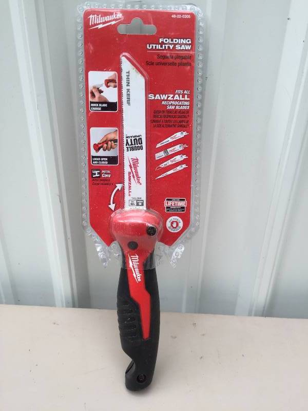 lot 24 image: Milwaukee Folding Utility Saw