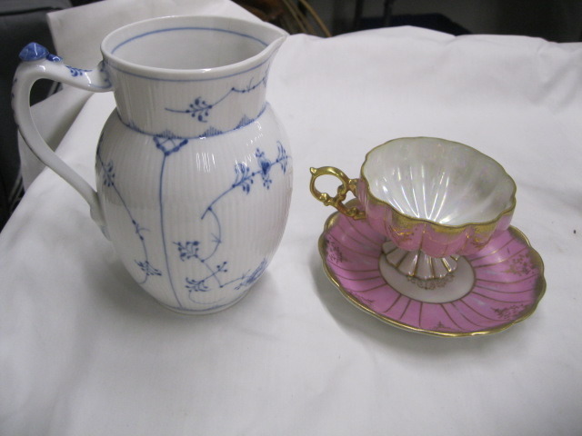 Cup and saucers, vase