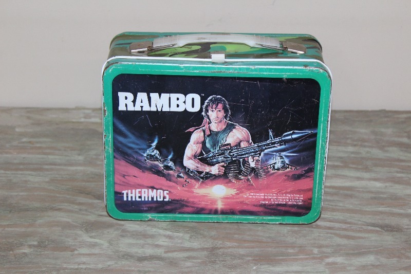 lot 21 image: 1985 Rambo Metal Lunchbox