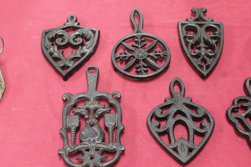 lot 176D image: Cast Iron Wall Hangings and a Vintage Fire Extinguisher Wall Holder