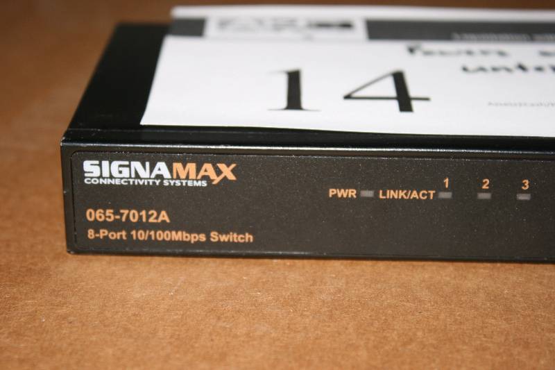 lot 14 image: Signamax Connectivity Systems Ethernet Switch 065-7012A 8-Port 10100Mbps Switch Powers On & Untested.